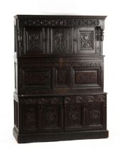 Property of a lady - a carved oak tridarn or court cupboard, parts 17th / 18th century, 55.5ins. (