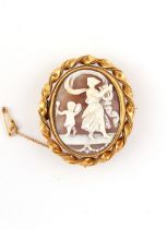 Property of a lady - a Victorian gilt metal oval framed carved shell cameo brooch, with rope border,