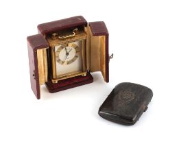 Property of a lady - a Swiss Looping brass cased travel alarm clock, with 15-jewel movement,
