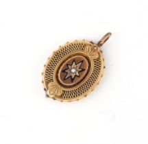 Property of a lady - a Victorian unmarked gold (tests 15ct) oval pendant, with dark blue enamel star