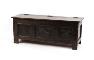 Property of a lady - a late 17th / early 18th century oak coffer, with carved panels, 51ins. (