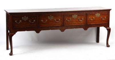 Property of a lady - a mid 18th century George II / III oak dresser base with four fruitwood