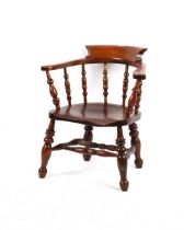 Property of a lady - a Victorian elm seated captain's chair or smoker's bow, with cut-outs to rear