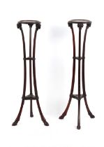 Property of a lady - a pair of Edwardian neo-classical Adam Revival mahogany torcheres, with