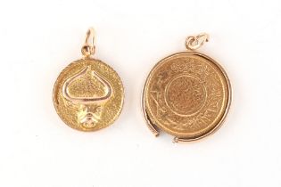 Property of a lady - a Saudi gold guinea coin pendant, the unmarked mount tests 9ct, approximately