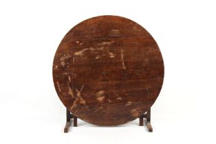 Property of a lady - a 19th century fruitwood circular topped folding table, evidence of woodworm