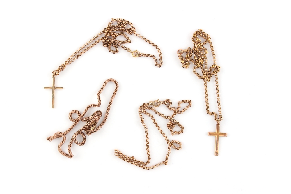 Property of a lady - four 9ct gold chain necklaces, two with a 9ct gross pendant (approximately 24.1