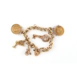 Property of a lady - a 9ct gold charm bracelet with heart shaped clasp, the five charms comprising