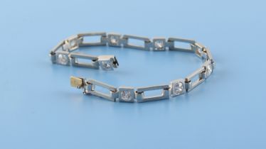 A 14ct white gold diamond bracelet, the nine round brilliant cut diamonds weighing a total of