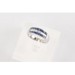 An 18ct white gold sapphire & diamond three row ring, set with a central row of nine princess cut