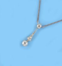 A Belle Epoque style diamond pendant on 18ct white gold chain necklace, the largest diamond