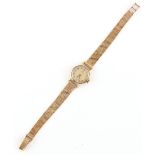 Property of a lady - a lady's Omega 9ct gold cased wristwatch with 9ct gold bracelet strap,