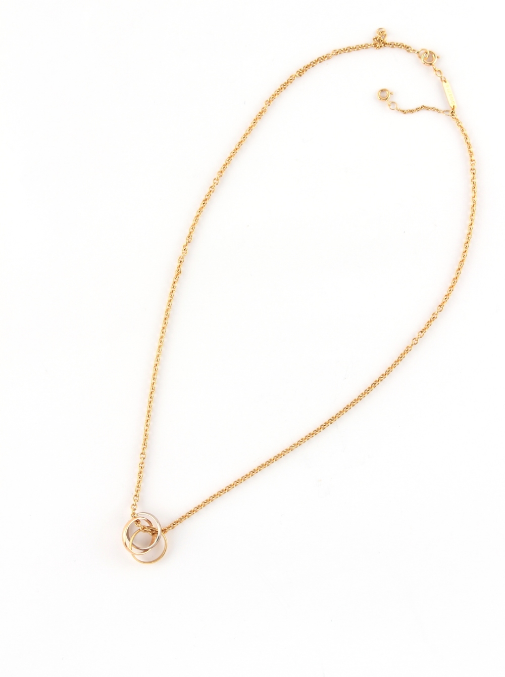 CARTIER - an 18ct three colour gold triple ring suspended from an 18ct yellow gold chain necklace, - Image 2 of 3