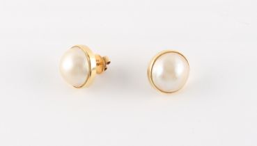 Property of a deceased estate - a pair of unmarked 14ct yellow gold (tested) half pearl stud