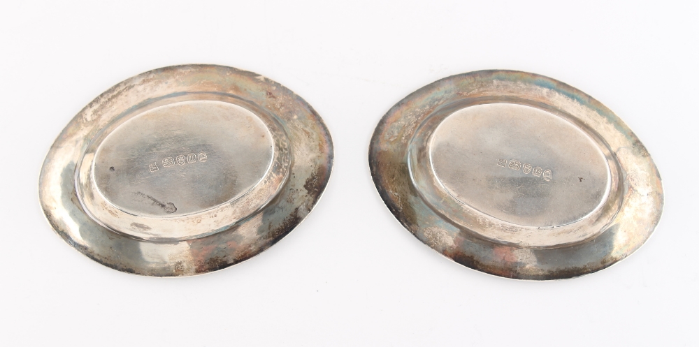 A pair of small George III silver oval dishes, each with engraved monogram & tower heraldic motif, - Image 2 of 2