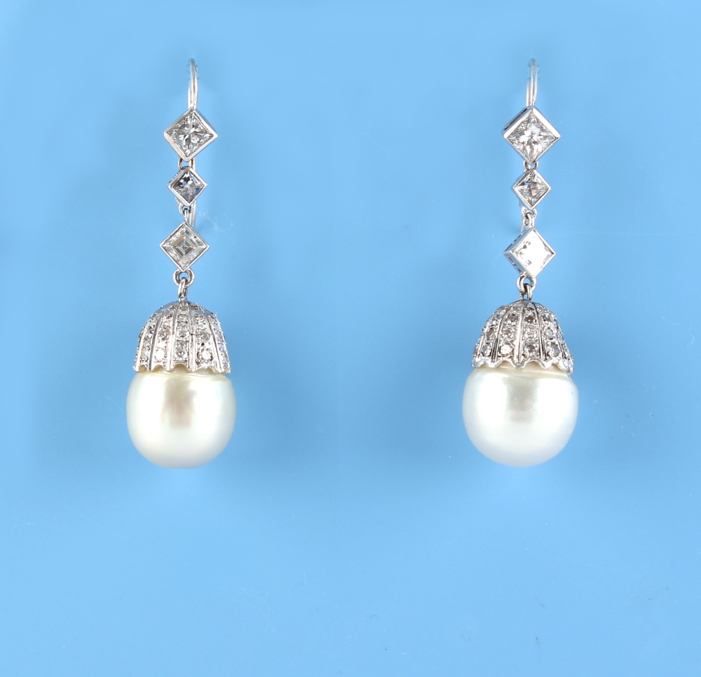 A pair of large pearl & diamond pendant earrings, the two pearls each approximately 12mm across,