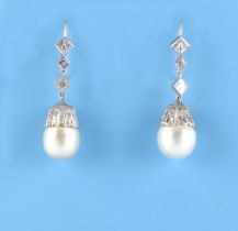 A pair of large pearl & diamond pendant earrings, the two pearls each approximately 12mm across,