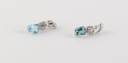 A pair of white gold aquamarine & diamond pendant earrings, the two octagonal cut aquamarines