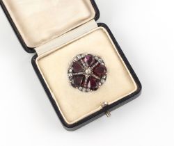 A 19th century garnet & diamond flowerhead brooch, with five pear shaped cut garnets, 28mm across,