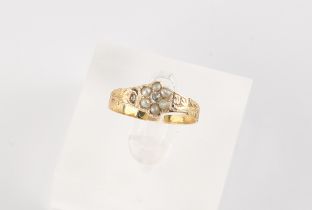 A 19th century unmarked yellow gold diamond & seed pearl cluster ring, with chased shank, size M/N.
