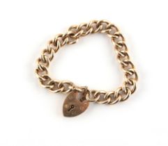 Property of a lady - a heavy 9ct gold chain link bracelet with heart shaped clasp, approximately