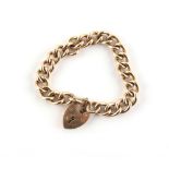 Property of a lady - a heavy 9ct gold chain link bracelet with heart shaped clasp, approximately