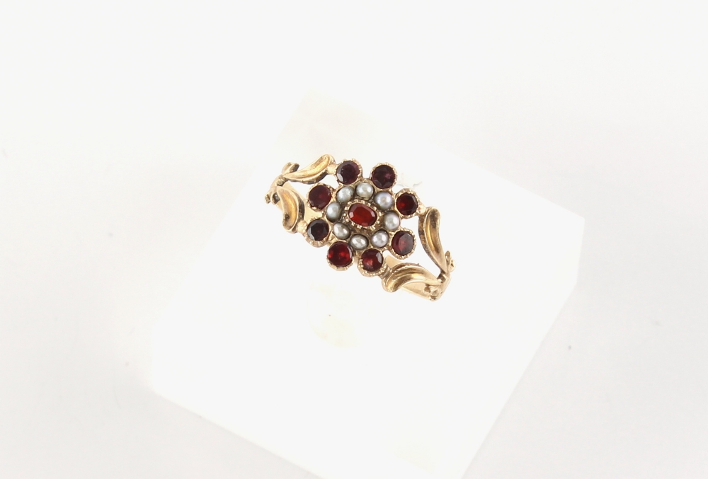 A 19th century unmarked yellow gold garnet & seed pearl cluster ring, with bifurcated shoulders,