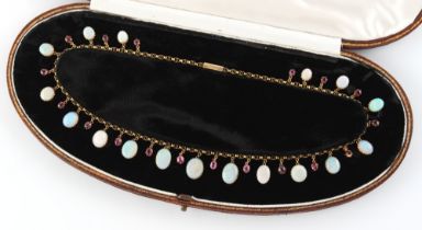 A Victorian opal & ruby fringe necklace, the eighteen oval cut rubies alternating with seventeen