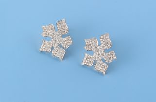 Ensuite with the preceding lot - a pair of unmarked 18ct yellow gold diamond floral stud earrings,
