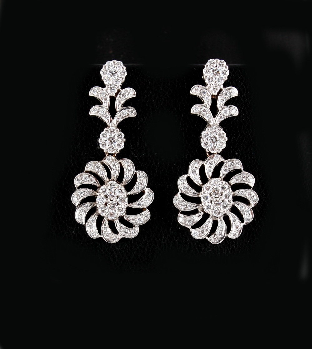 A pair of white gold diamond flowerhead pendant earrings, the estimated total diamond weight 2.0 - Image 2 of 2