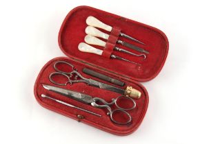 Property of a lady - a red morocco sewing case containing assorted implements including an