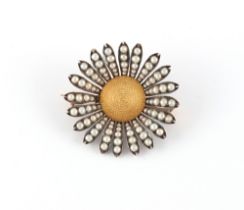 An unusual late 19th / early 20th century unmarked gold & seed pearl sunburst or flowerhead