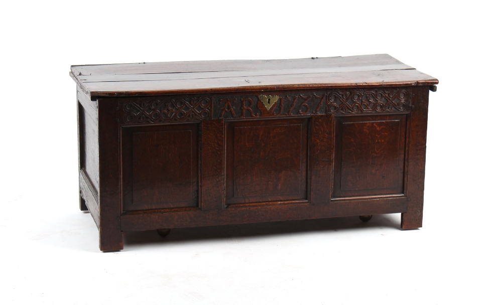 Property of a lady - an 18th century oak coffer, the front with three fielded panels below a