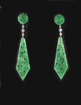 A pair of unmarked white gold carved & pierced jadeite & diamond pendant earrings, each