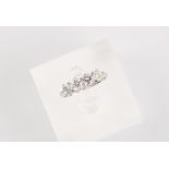 A platinum diamond four stone ring, the round brilliant cut diamonds weighing a total of