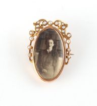 Property of a lady - an unmarked gold (tests 15ct) & seed pearl portrait brooch, engraved