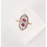 A Belle Epoque style 18ct yellow gold ruby & diamond ring, the two round cut rubies weighing