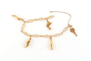 Property of a deceased estate - an 18ct yellow gold charm bracelet with five charms (one marked