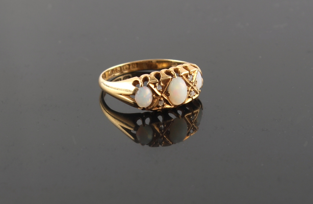 Property of a lady - an early 20th century 18ct yellow gold opal & diamond ring, the largest of