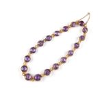 Property of a lady - a late Victorian unmarked yellow gold (tests 15ct) amethyst riviere necklace,