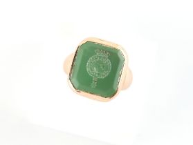 Property of a deceased estate - an unmarked 9ct gold (tested) intaglio seal ring, the pale green