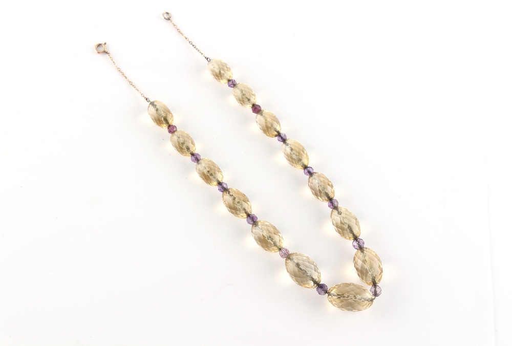 Property of a lady - a faceted oval citrine & amethyst bead necklace, the largest citrine