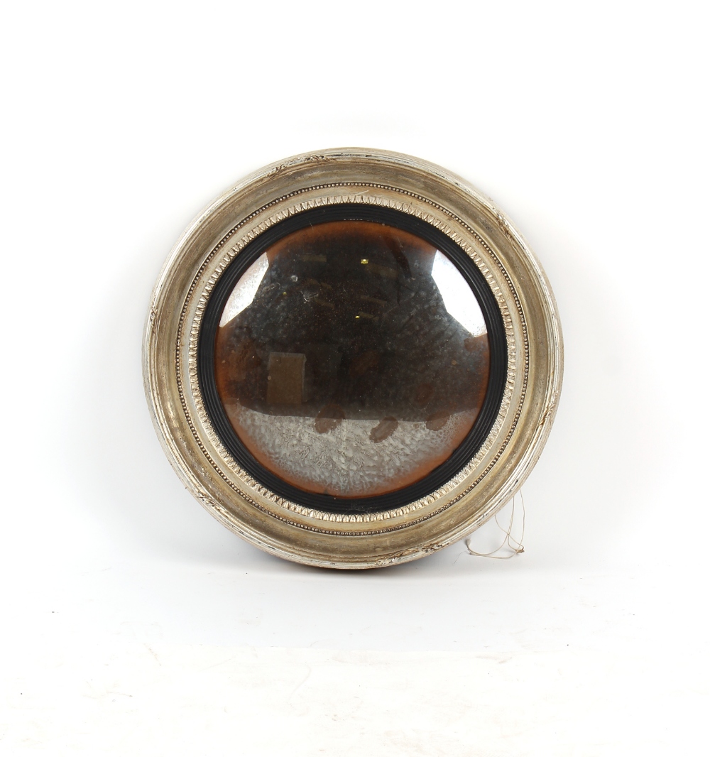 Property of a lady - an early 20th century silvered wood circular framed convex mirror, 26ins. (
