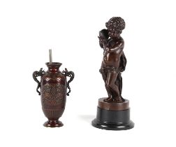 Property of a deceased estate - a late 19th century patinated bronze figure of a putto with