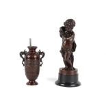 Property of a deceased estate - a late 19th century patinated bronze figure of a putto with