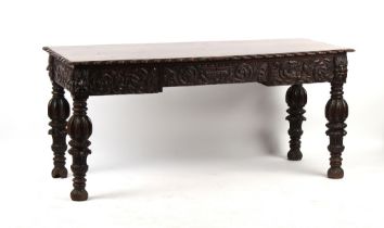 Property of a lady - a Victorian carved dark oak rectangular topped table, carved to all sides, with