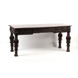 Property of a lady - a Victorian carved dark oak rectangular topped table, carved to all sides, with