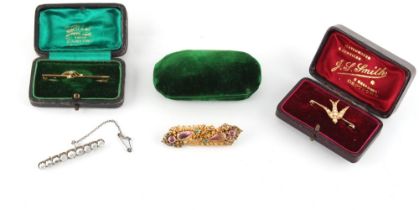 Property of a deceased estate - a late Georgian gold cannetille brooch set with two emeralds &