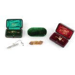 Property of a deceased estate - a late Georgian gold cannetille brooch set with two emeralds &