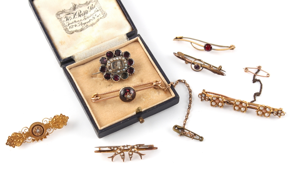 Property of a lady - an unmarked yellow gold (tests 15ct) bar brooch set with seed pearls, 52mm